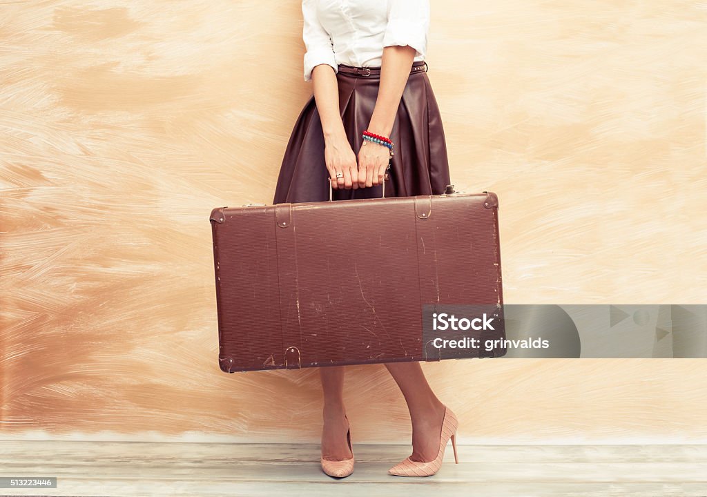 Woman holding antique suitcase for traveling Suitcase Stock Photo