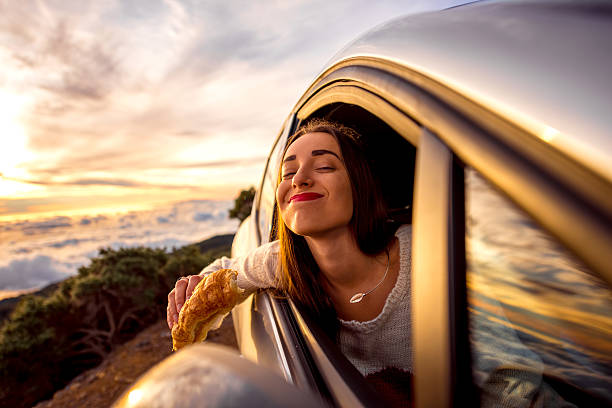 istock Woman eating in the car 513224172