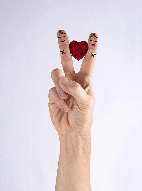 istock hurrahs love,heart between the fingers 513224450