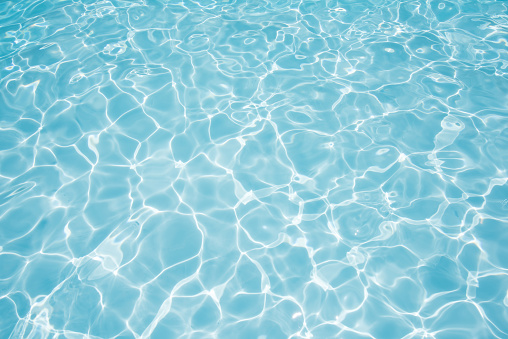 Swimming pool side water surface in sunlight