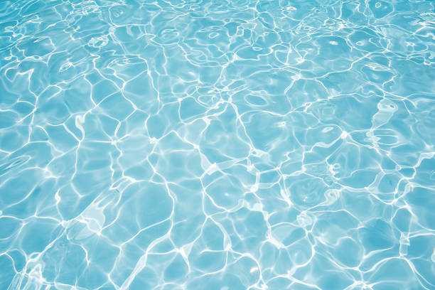 water in swimming pool Beautiful water surface in swimming pool with sun reflection swimming pool stock pictures, royalty-free photos & images