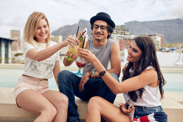 istock Happy young friends having cocktail party 513225640