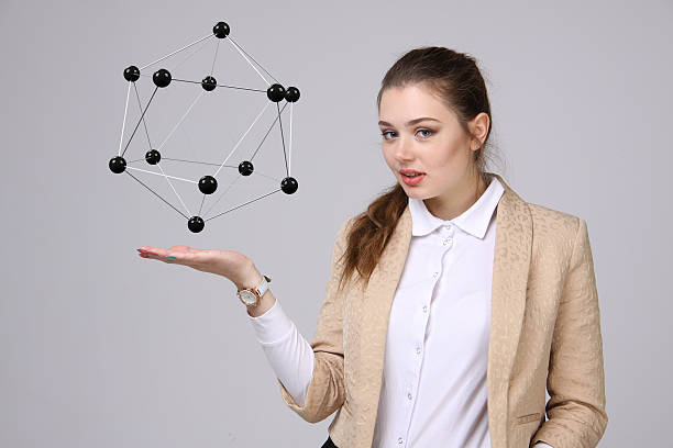 istock Woman scientist holding model of molecule or crystal lattice 513225656