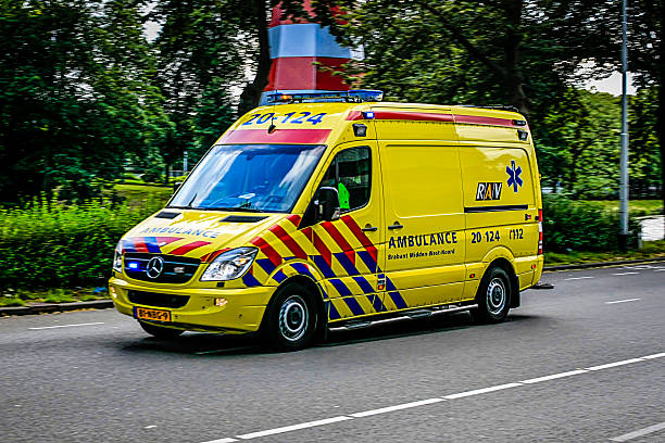 Breda Nassaustad, NL, EU - July 19, 2012: Dutch RAV yellow ambulance in downtown Breda, Holland