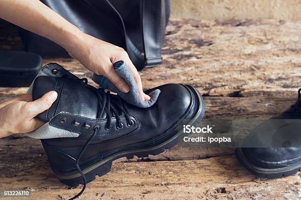 Cleaning Shoes On Wooden Background Stock Photo - Download Image Now - Cleaning, Leather, Boot