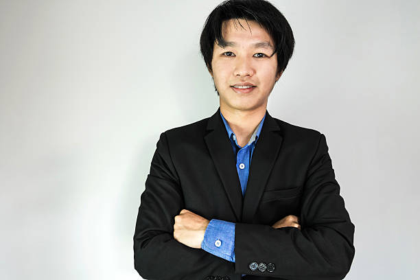 istock Young Businessman smiling, on white background 513226820