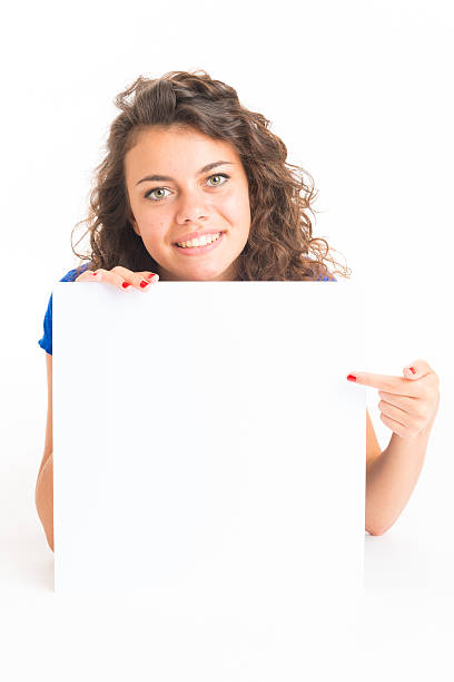 istock Young cute woman holding a white card 513226927