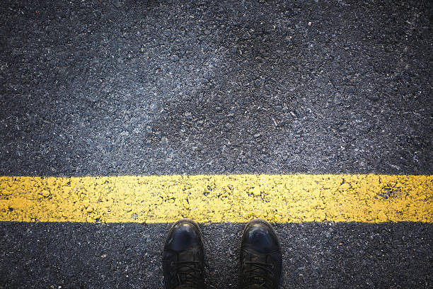 istock People at a starting yellow line on asphalt 513227438