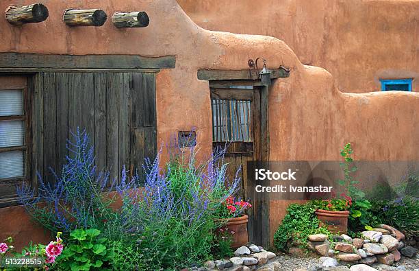 Santa Fe Old Adobe House With Stucco Wall And Flowers Stock Photo - Download Image Now