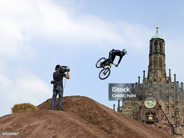 Flying Cyclist District Ride In Nuremberg Stock Photo - Download Image Now - Activity, Adult, Audience