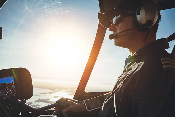 istock Pilot flying a helicopter on a sunny day 513229428