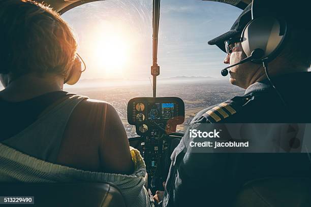 Man Flying A Helicopter With His Copilot Stock Photo - Download Image Now - Helicopter, Cockpit, Helicopter Pilot
