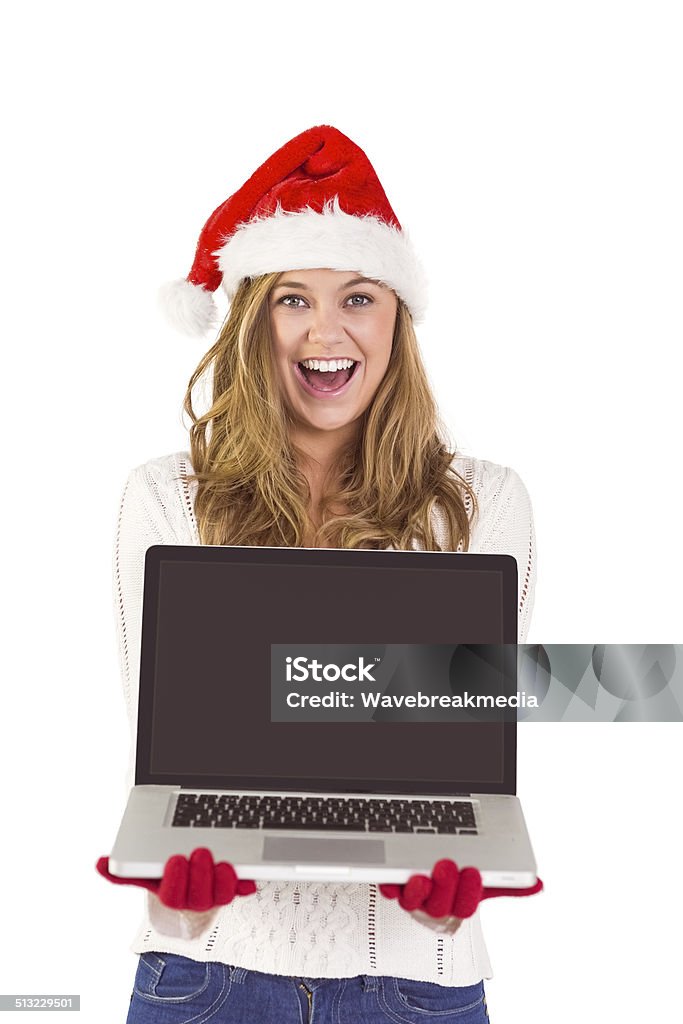 Festive blonde showing a laptop Festive blonde showing a laptop on white background 20-24 Years Stock Photo