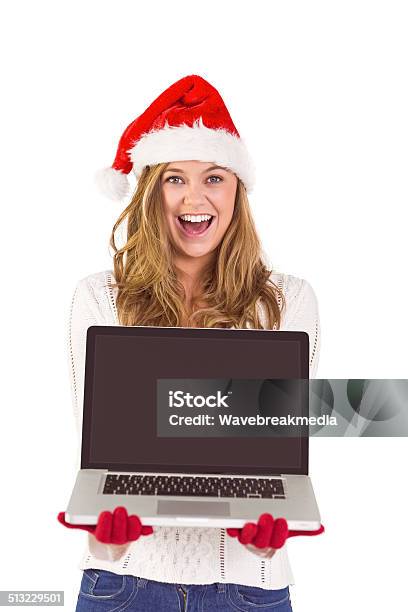 Festive Blonde Showing A Laptop Stock Photo - Download Image Now - 20-24 Years, 20-29 Years, Adult