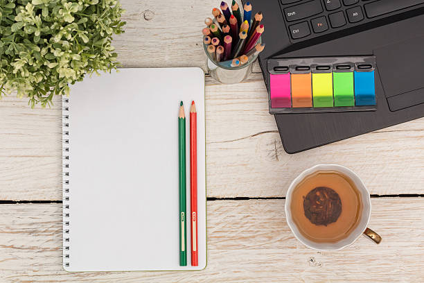 istock Morning in the office: notebook, laptop and tea 513229930