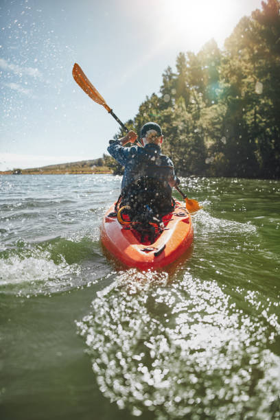 istock Mature man paddling a kayak 513230424
