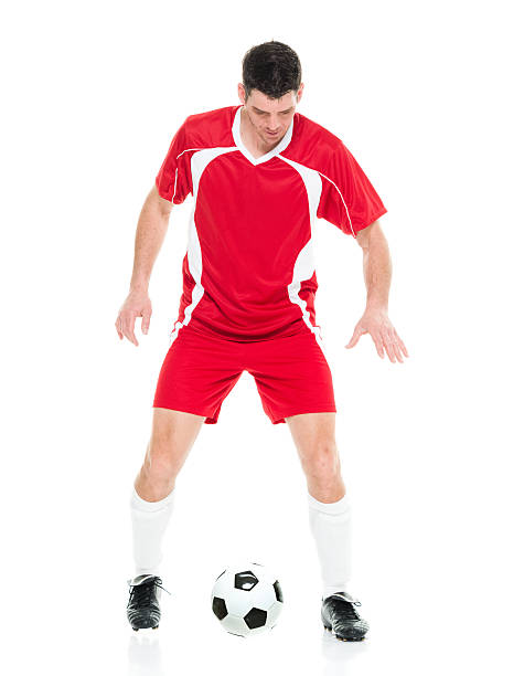 istock Male soccer player in action with ball 513230974