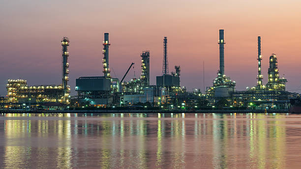 istock river side oil refinery industry plant along twilight morning 513231270