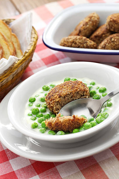 istock hungarian green peas stew and fried meatball 513232250