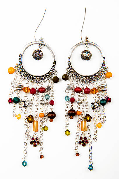 istock Pair of earrings isolated on the white background 513232397