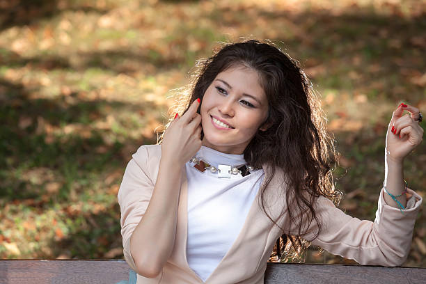 istock young woman siting on bench 513232761