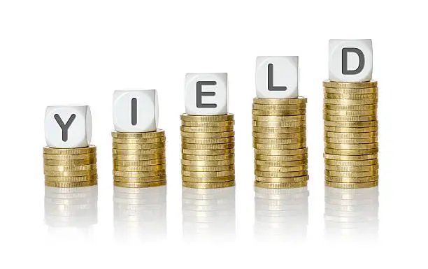 Photo of Coin stacks with letter dice - Yield