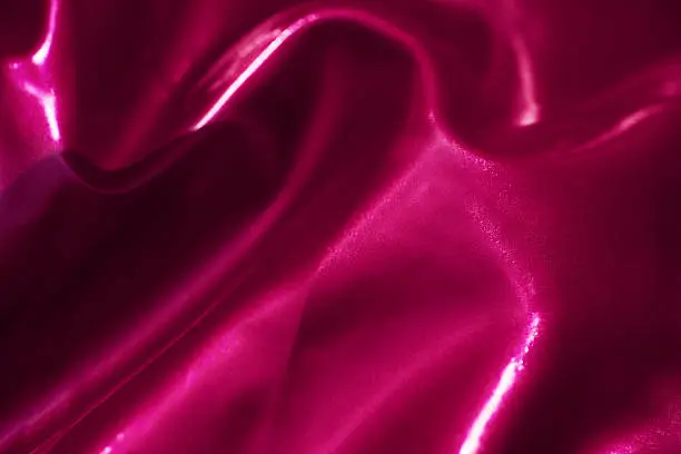 macro shot of pink latex background, shiny texture.horizontal shot.