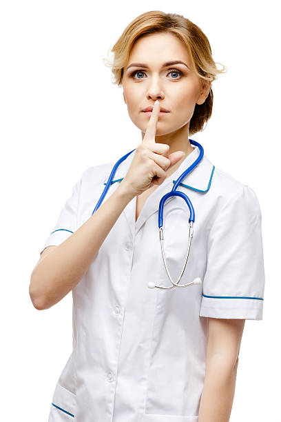 istock Woman doctor standing on white background 513234436