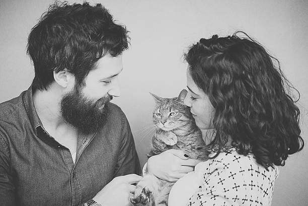 istock happy couple with cat 513234538