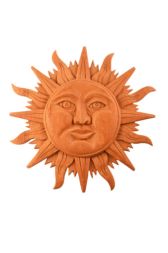 Mexican traditional Mayan culture wooden carved sun symbol plate isolated on white