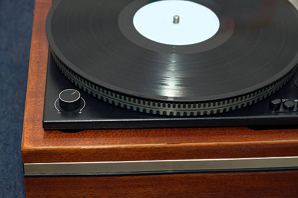 istock Old turntable with wooden finish top view isolated 513237464