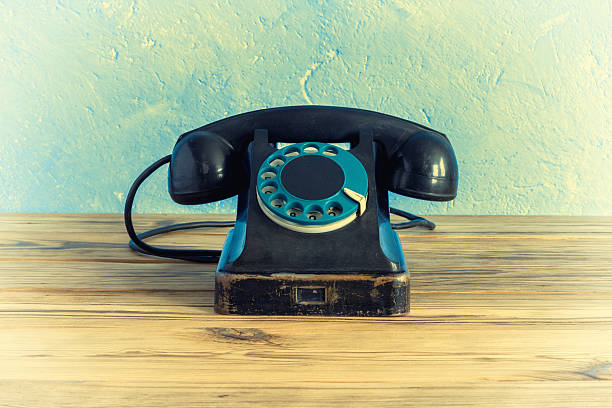 istock Vintage phone on a wooden table 513238884
