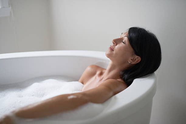 istock mature woman in a bathtub 513241398
