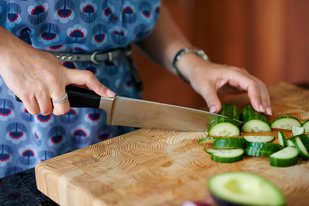 istock Mature woman chopping vegetables 513241882