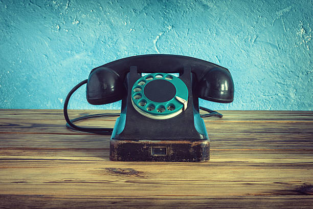 istock Vintage phone on a wooden table 513241900
