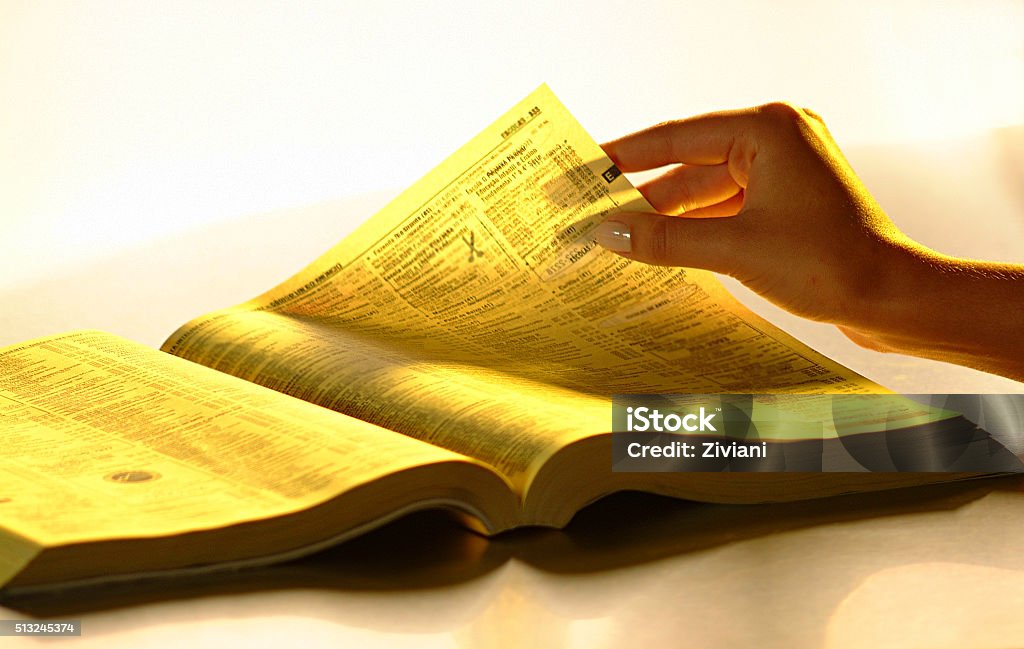 female hands with phone book Telephone Directory Stock Photo