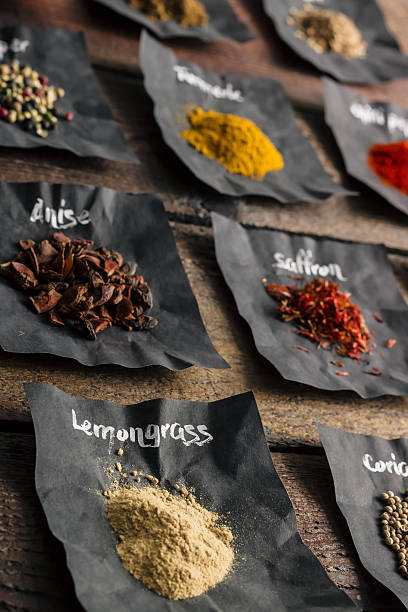 istock Colourful spices on wooden table 513247992