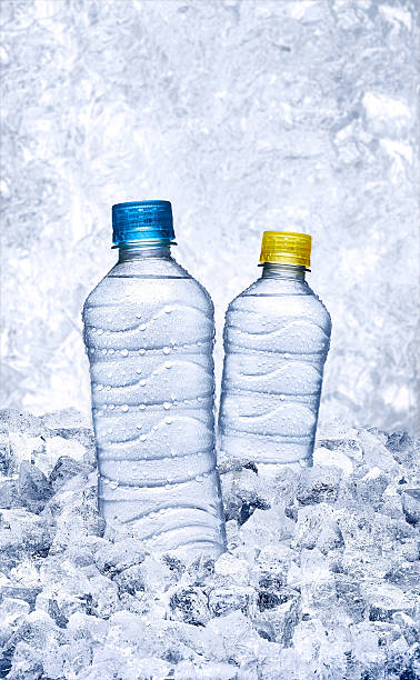 bottle of water with ice bottle of water with ice frozen water stock pictures, royalty-free photos & images