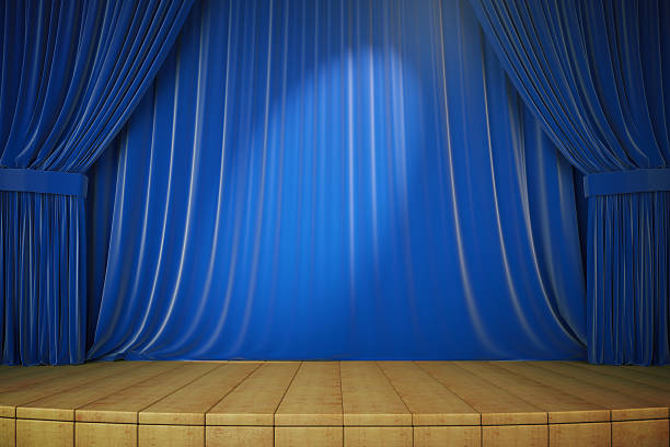 istock Wooden stage with blue curtains and spotlight, 3d render 513248646