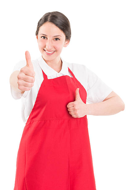 mujer joven supermercado empleado mostrando pulgar hacia arriba - manual worker thumbs up hand sign adult fotografías e imágenes de stock