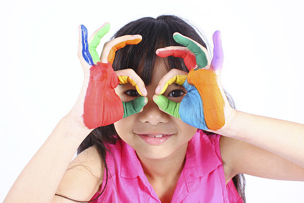 istock Cute girl with hands in the paint 513249158