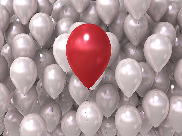istock background of white balls with a red ball 513250630