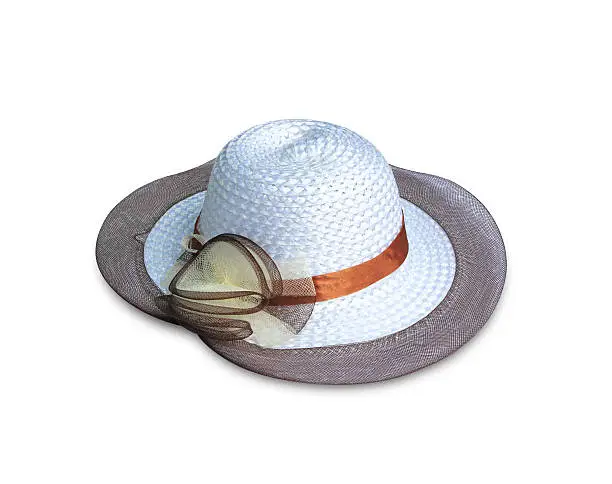 Pretty straw hat with flower on white background