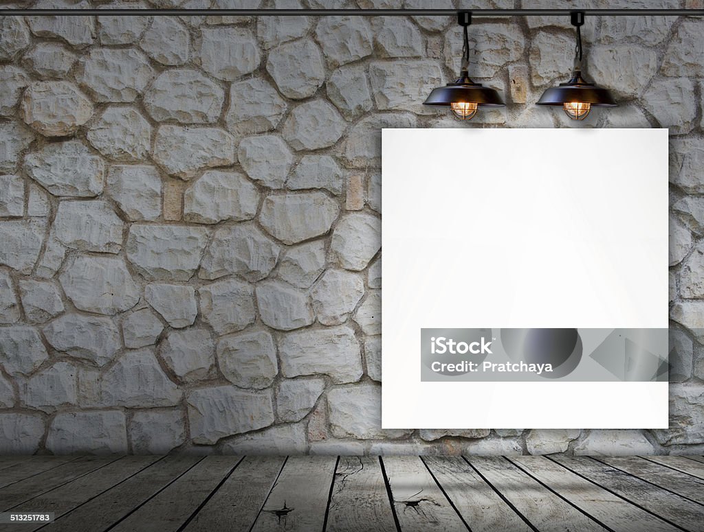 Blank frame on stone wall and wood floor Blank frame on stone wall and wood floor for information message Abstract Stock Photo