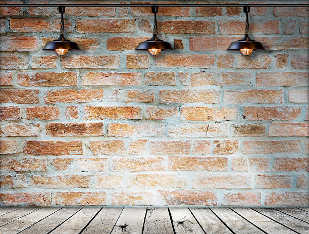 istock Lamp at brick wall background with ground wood 513252185