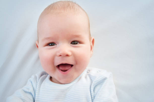 istock three month old baby lying in bed 513252788