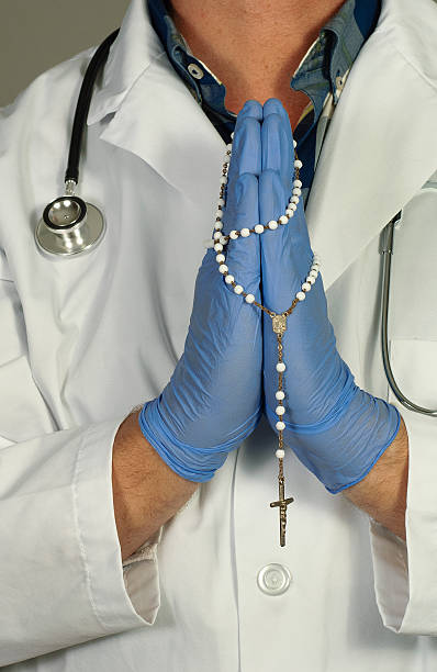istock Doctor Prays for a Miracle 513253312