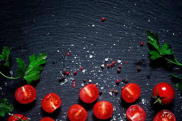 istock Food background, sliced and whole cherry tomatoes 513253466