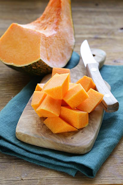 istock fresh orange pumpkin on the kitchen board 513253479