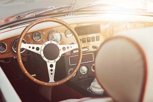 Oldtimer car interior with steering wheel and cockpit